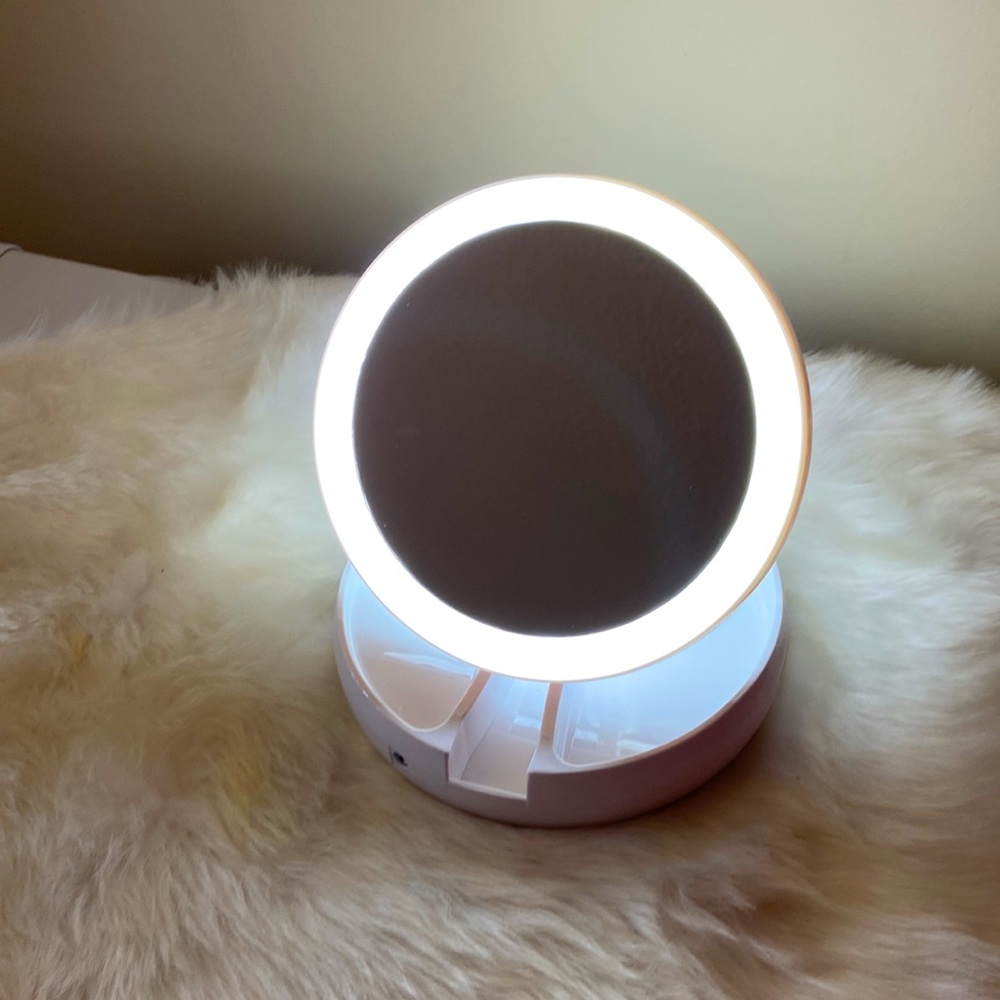 Lighted mirror with tray